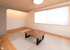 シンプルで落ち着いた和室。モダンな畳と木製のテーブルが心地よい空間を演出。静かに過ごせる贅沢なひとときを。